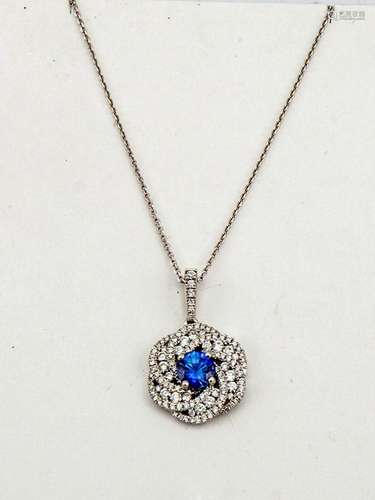 An 18ct white gold blue sapphire and diamond pendant necklace, the brilliant cut sapphire 1.19ct,