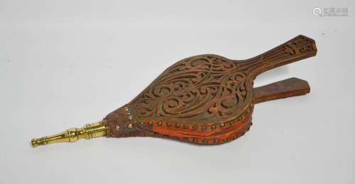 An antique pair of wooden and leather bellows, with brass tip, pierced decoration on one side and