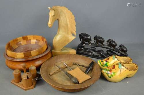 A group of treen to include bowls, carved horse, and carved African group of elephants and other