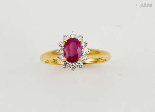 An 18ct yellow gold, ruby and diamond ring, the ruby approx 1ct, bordered by 0.33ct diamonds, size