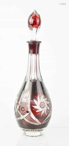 A red Bohemian cut glass decanter, 37cm high.