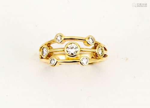A 9ct yellow gold seven stone diamond ring, in the contemporary 'rain dance' style, size N, 3.6g.