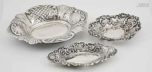 Two silver bon bon dishes, with embossed and pierced decoration, together with a silver plated