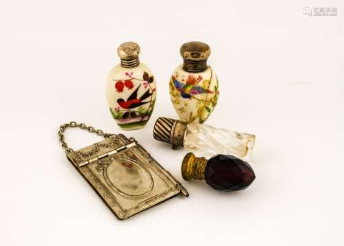 Four antique perfume bottles, two ceramic examples, and two glass, together with an Edwardian silver