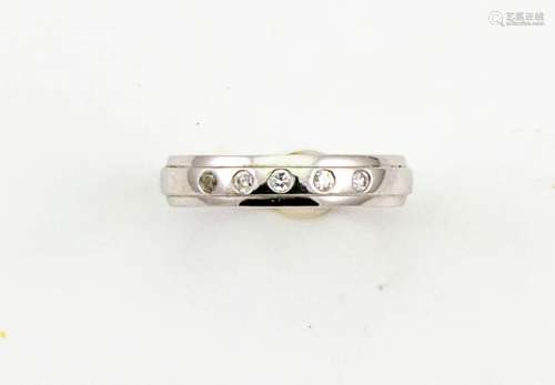 A platinum and diamond band, marked 950, set with five brilliant cut diamonds, size N 4.6g.