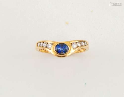 An 18ct gold, sapphire and diamond ring, in the wishbone style, with an oval cut sapphire, size