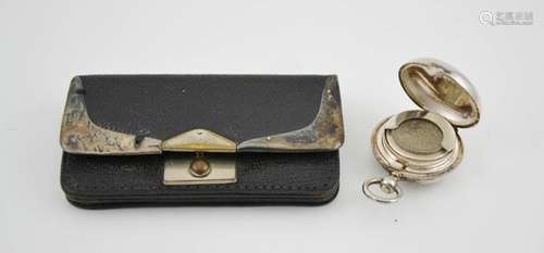 A silver plated coin case, and a leather and silver purse.