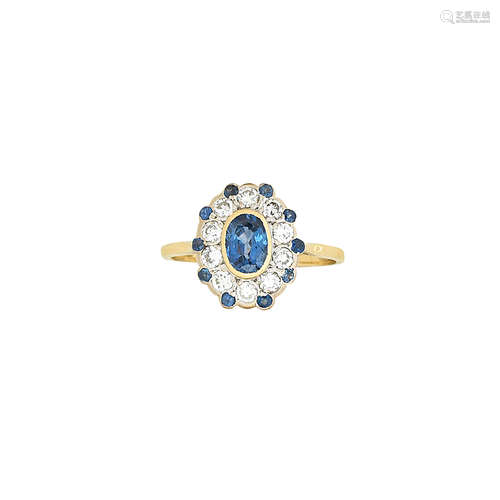 A sapphire and diamond cluster ring, retailed by Joseph Bonnar