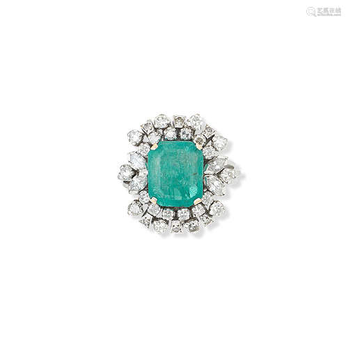 An emerald and diamond cluster ring