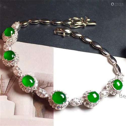 A Chinese Carved Jadeite Bracelet