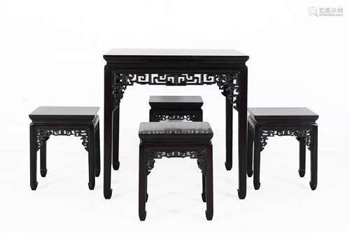 A Set of Chinese Carved Hardwood Table and Chairs