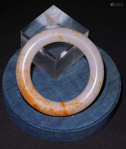 A HETIAN JADE CARVED BANGLE