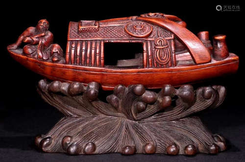 A BAMBOO CARVED BOAT SHAPED PENDANT