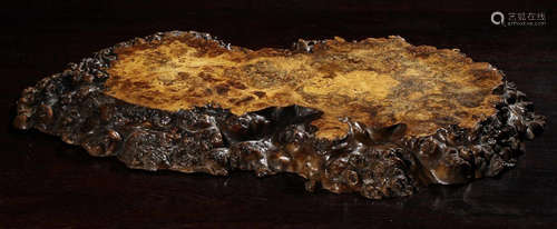 A BURL CARVED TEA PLATE