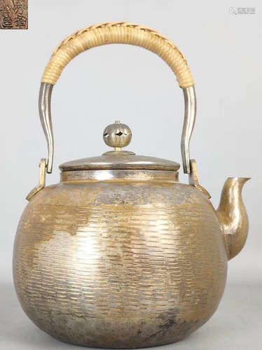 A GILT SILVER CASTED POT WITH HANDLE