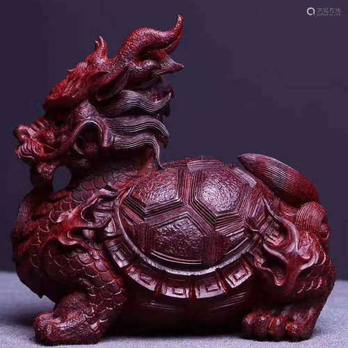 AN INDIAN XIAOYE ZITAN WOOD BEAST SHAPE PENDANT