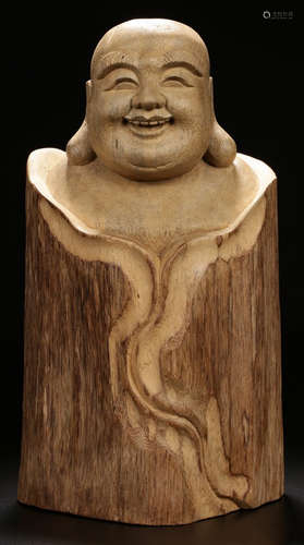 A TANXIANG WOOD CARVED MAITREYA ORNAMENT