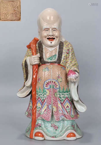 A FAMILLE ROSE GLAZE FIGURE SHAPED STATUE