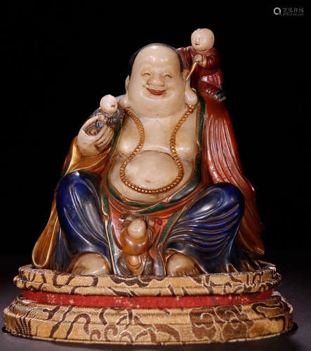 A SOAPSTONE CARVED MAITREYA STATUE