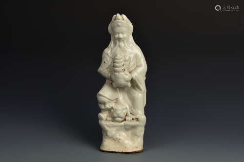 A WHITE GLAZED STANDING FIGURE QING DYNASTY
