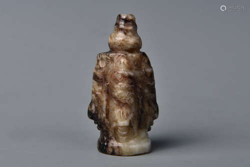 A WHITE AND RUSSET JADE AMULET YUAN DYNASTY