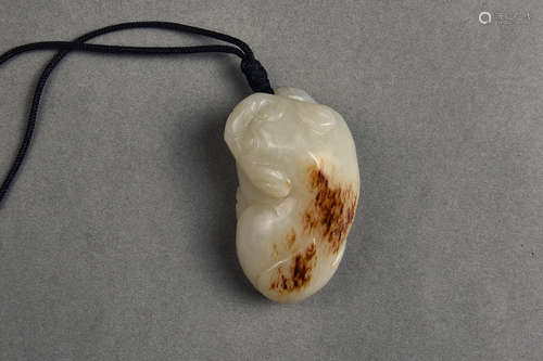 A WHITE AND RUSSET JADE BADGER