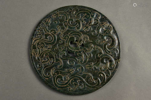 AN INCISED SPINACH GREEN BI QING DYNASTY