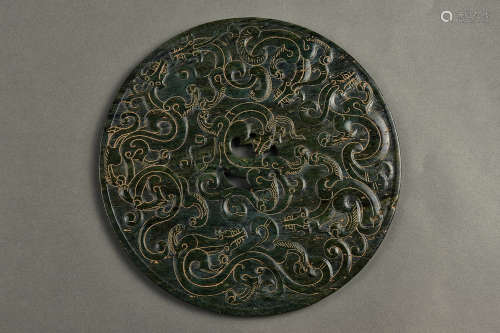 AN INCISED SPINACH GREEN BI QING DYNASTY