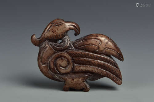 A CARVED RUSSET JADE PHOENIX QING DYNASTY