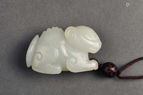 A CARVED WHITE JADE BEAR