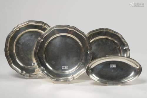 Set of four silverware: three round scroll plates,…