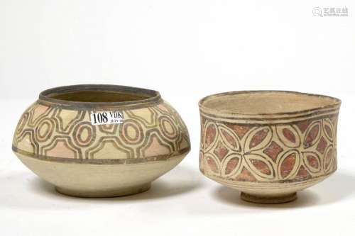 Two terracotta vessels with vegetal decoration and…