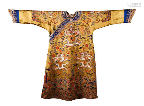 A CHINESE GOLD SILK DRAGON ROBE WITH BLUE EDGE