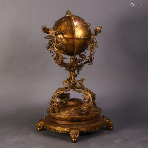 A CHINESE GILT BRONZE DRAGON STANDING EARTH MOVING GLOBE