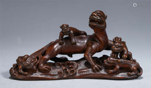 A CHINESE AGALWOOD MOTHER AND SON BEAST BRUSH HOLDER