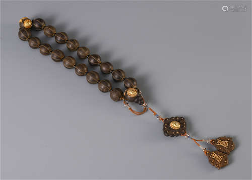 A CHINESE AGALWOOD INLAID GILT HAND HELD ROSARY