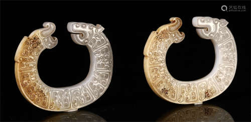 A PAIR OF CHINESE CARVED BEAST SHAPED HOOK