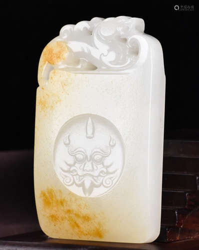 A HETIAN JADE PENDANT CARVED WITH DRAGON