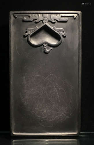 AN INK SLAB CARVED WITH PATTERN