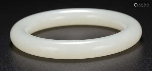 A HETIAN JADE CARVED BANGLE