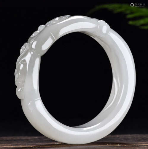 A HETIAN JADE BANGLE CARVED WITH DRAGON