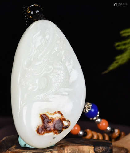 A HETIAN JADE PENDANT CARVED WITH DRAGON