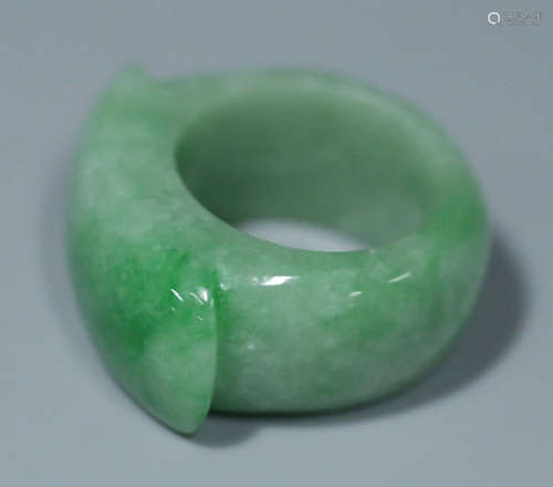 AN ICEY JADEITE CARVED RING