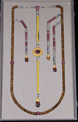A TOURMALINE CARVED NECKLACE WITH RUBY