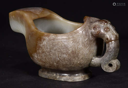 A HETIAN JADE CARVED BEAST PATTERN CUP