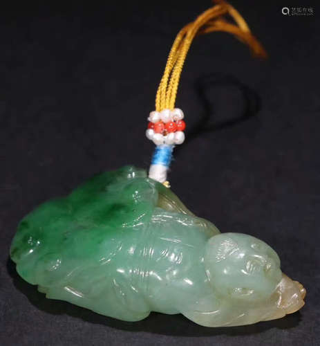 A JADEITE CARVED KID SHAPED PENDANT