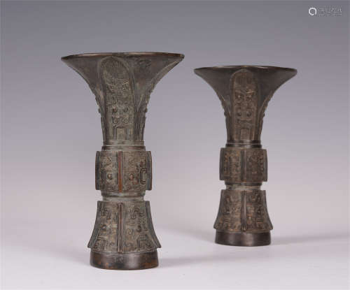 A PAIR OF CHINESE BRONZE CARVED FLOWER GU VASE