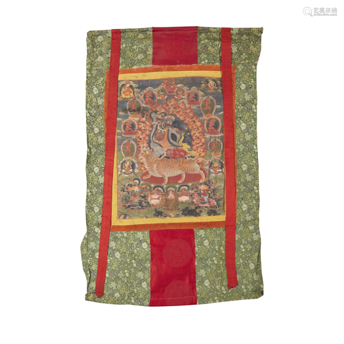 A Tibetan thangka depicting a wrathful deity…