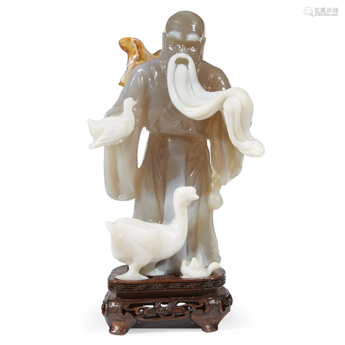 A carved agate figure of Wang Xizhi, 20t…