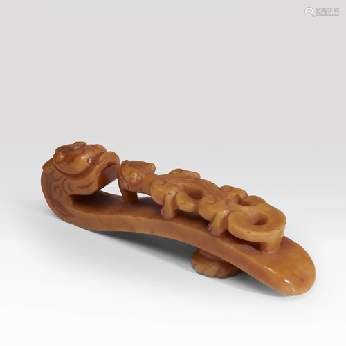 A large Chinese carved caramel-yellow ag…